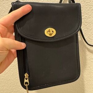 Coach Black Leather Passport Bag with Gold Accents